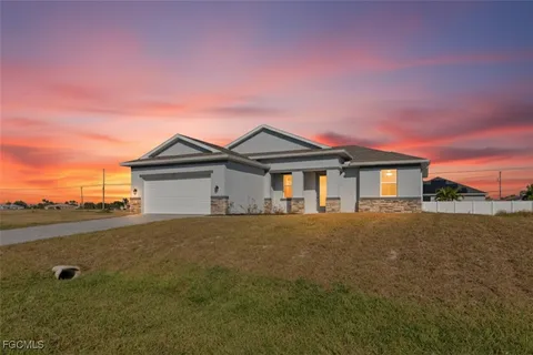 a living room with furniture kitchen view and a table