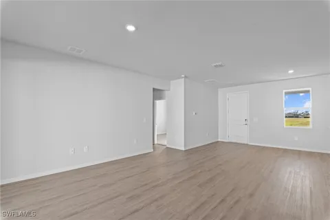 a kitchen with stainless steel appliances a refrigerator and a stove top oven