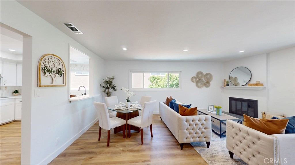 1354 Shadow Fullerton, CA 92831 - Photo 19 of 30 a living room with furniture kitchen view and a fireplace