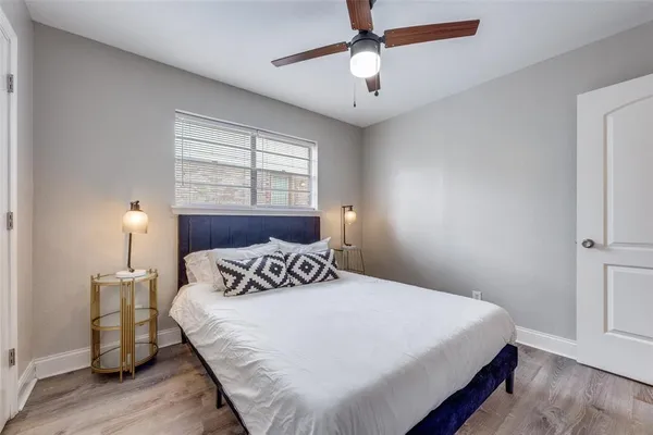 a bedroom with a bed and a window