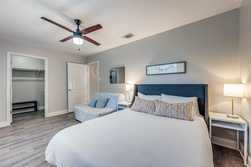 1222-1224 West Hunt Street, Unit 1222 Sherman, TX 75092 - Photo 19 of 23 a bedroom with a bed and a chandelier
