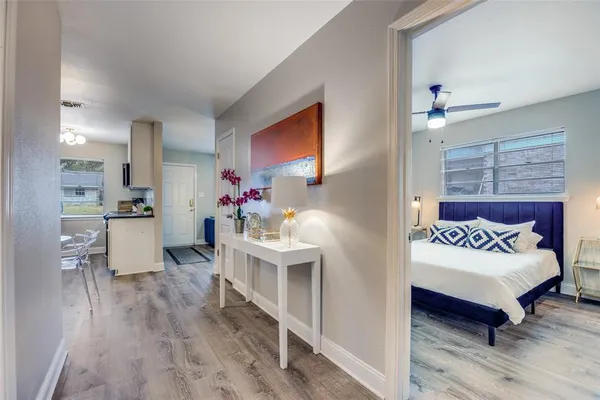 a bedroom with furniture and a wooden floor