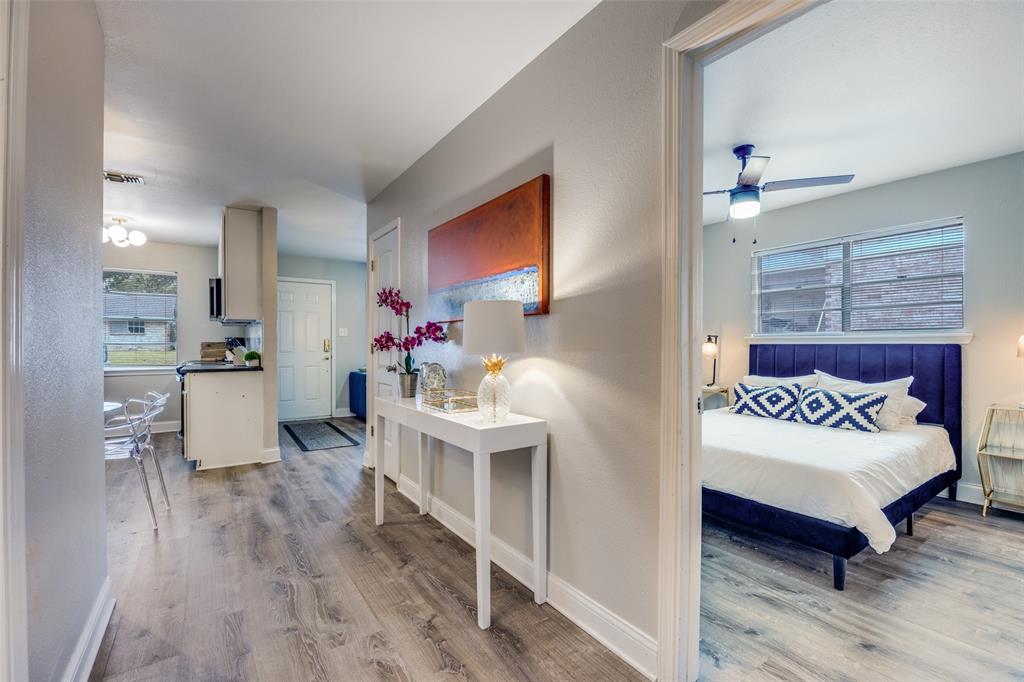 1222-1224 West Hunt Street, Unit 1222 Sherman, TX 75092 - Photo 22 of 23 a bedroom with furniture and a wooden floor