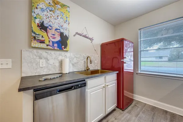 a kitchen with stainless steel appliances a stove and a microwave