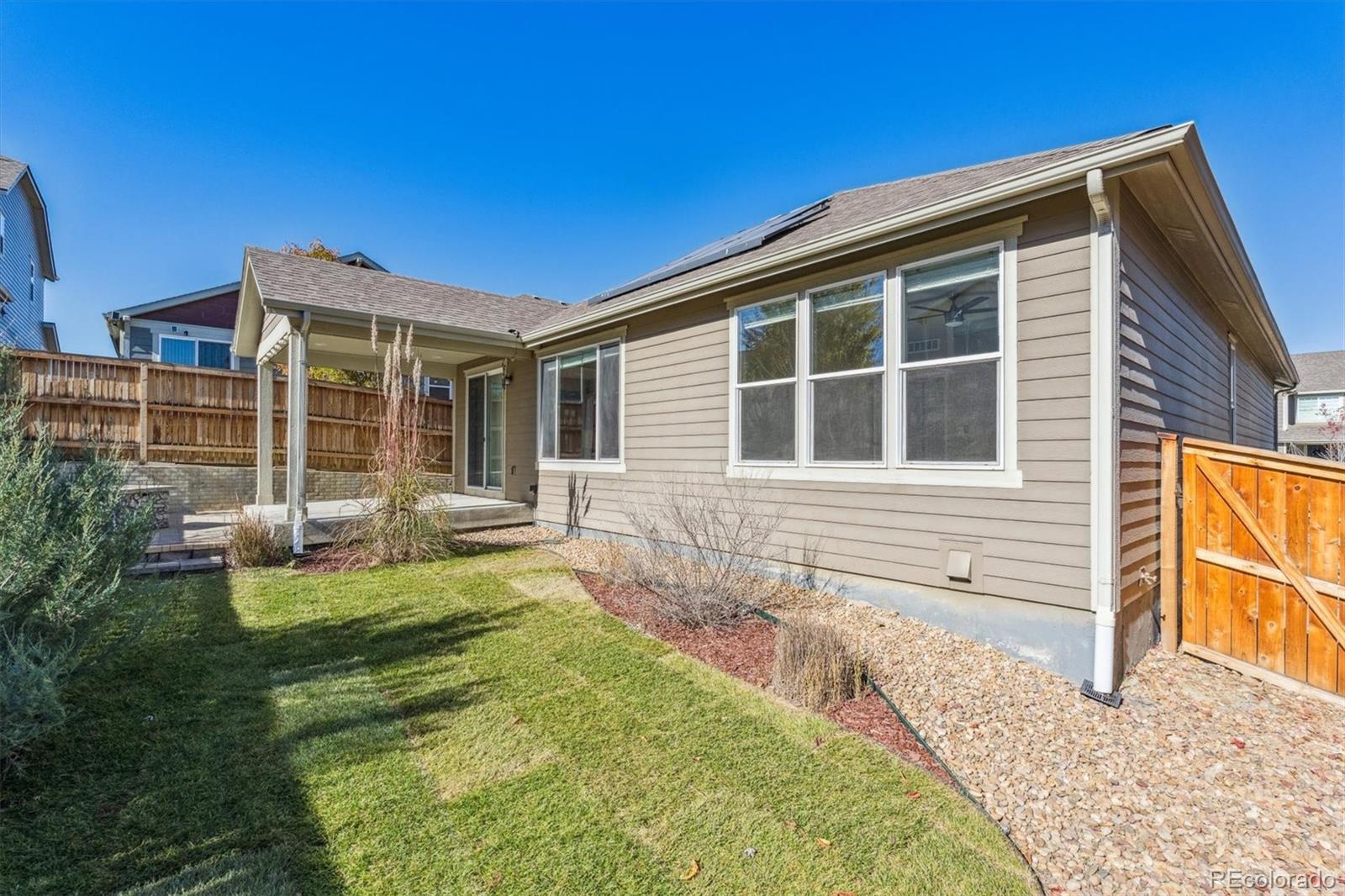 767 Wagon Bend Road Berthoud, CO 80513 - Photo 17 of 21 a view of a house with backyard and sitting area