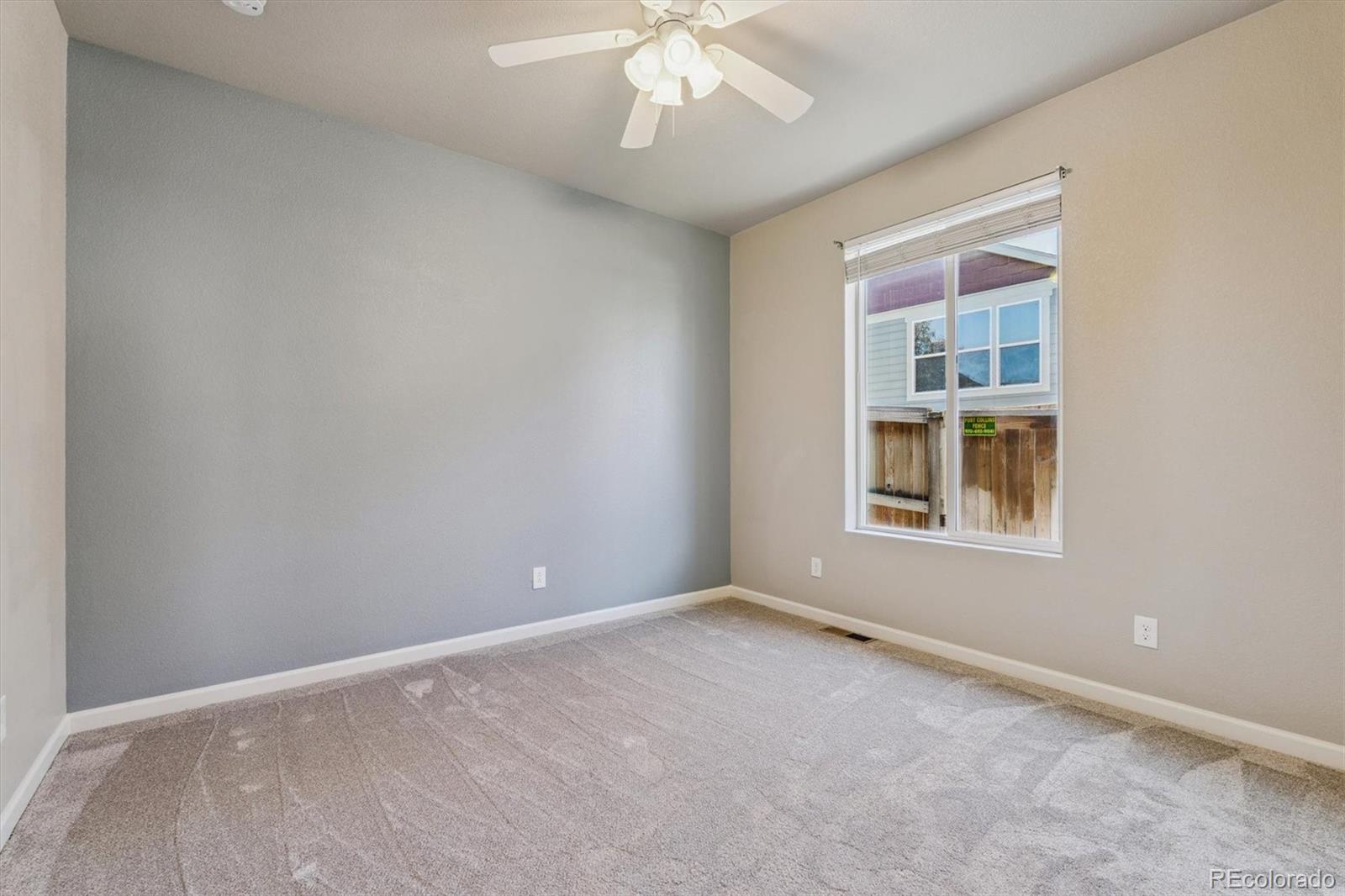 767 Wagon Bend Road Berthoud, CO 80513 - Photo 8 of 21 an empty room with a window