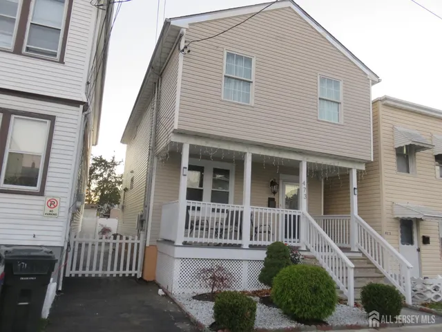 a front view of a house with a porch