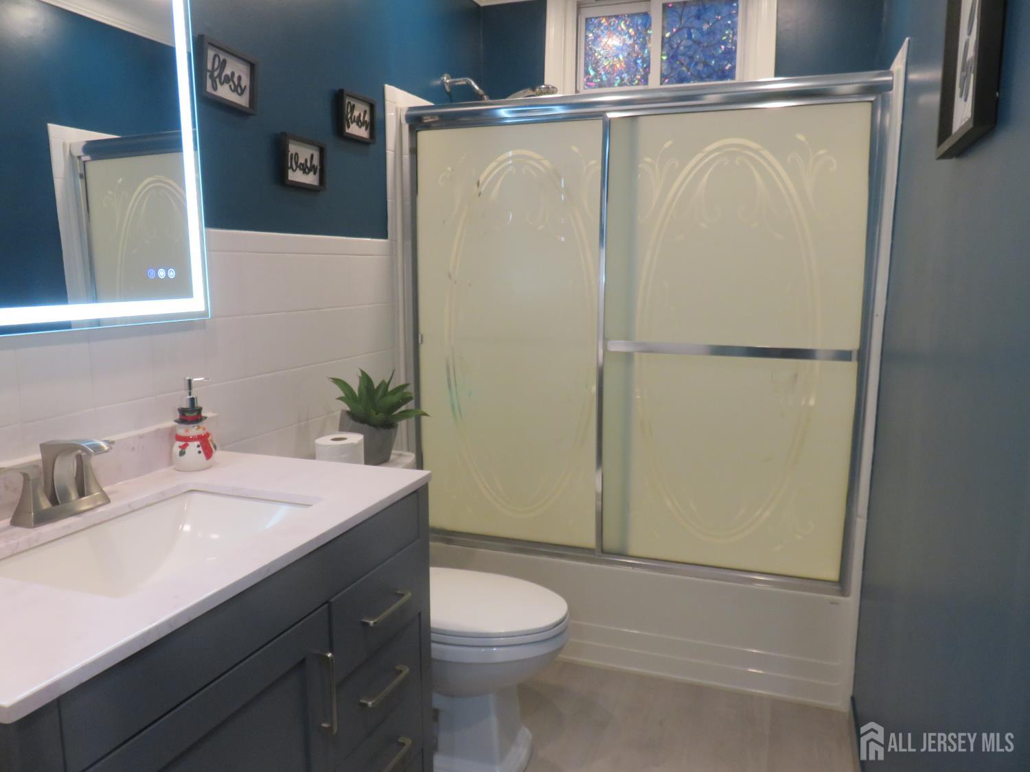 473 Hall Avenue Perth Amboy, NJ 08861 - Photo 11 of 21 a bathroom with a sink a toilet and shower