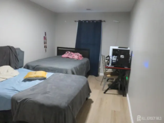 a bedroom with a bed and a lamp