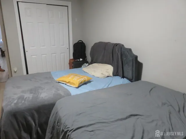 a bedroom with a bed and chair