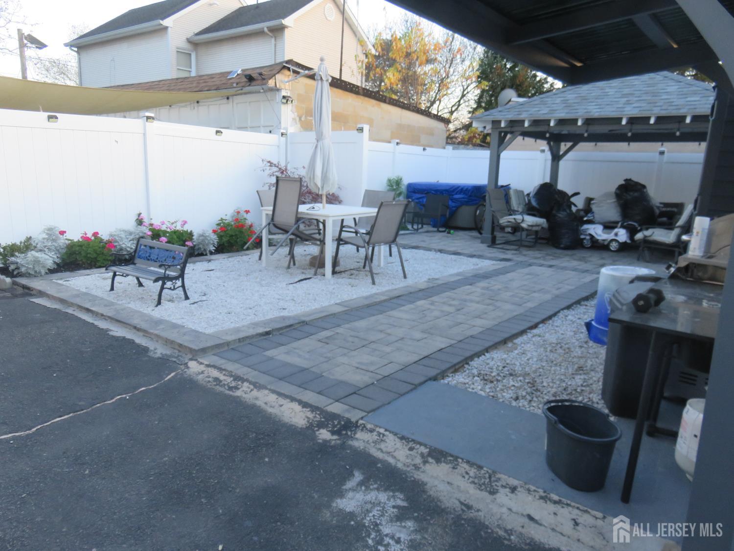473 Hall Avenue Perth Amboy, NJ 08861 - Photo 3 of 21 a view of a patio with table and chairs