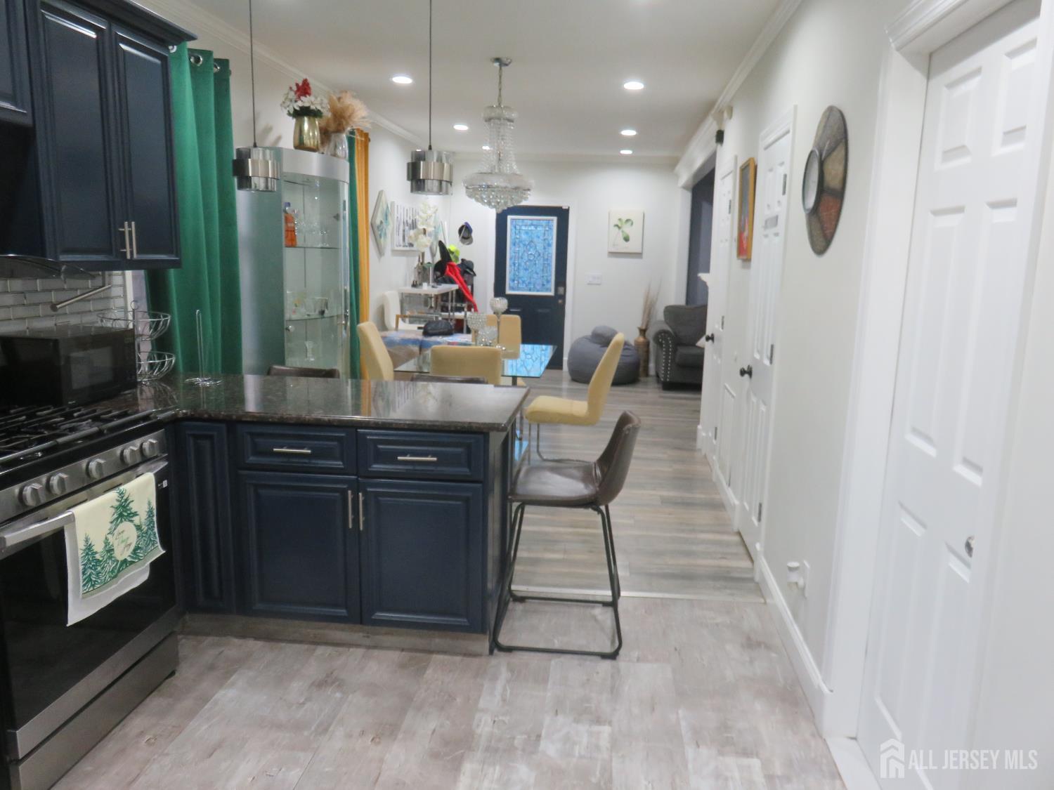473 Hall Avenue Perth Amboy, NJ 08861 - Photo 9 of 21 a kitchen with stainless steel appliances granite countertop a refrigerator and a stove top oven