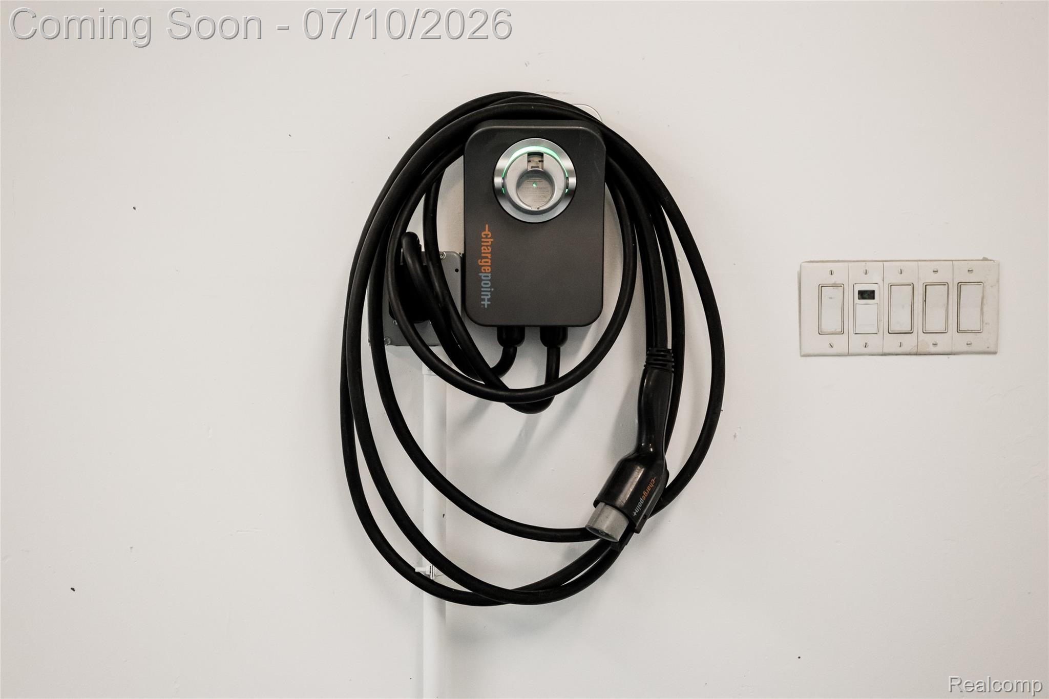 600 Middlesex Road Grosse Pointe, MI 48230 - Photo 35 of 43 Wall-mounted electric vehicle charging station with integrated cable management