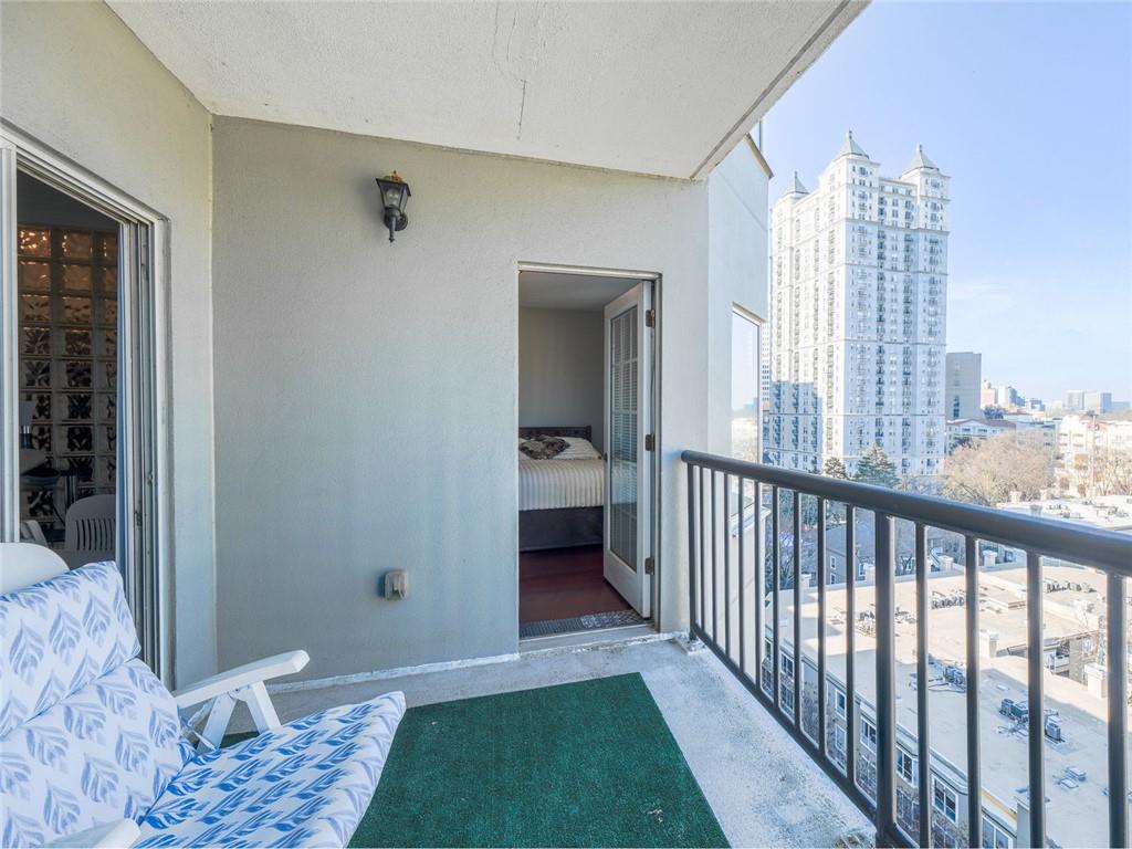 275 13th Street Northeast, Unit 1106 Atlanta, GA 30309 - Photo 14 of 22 a view of a bedroom with furniture and window