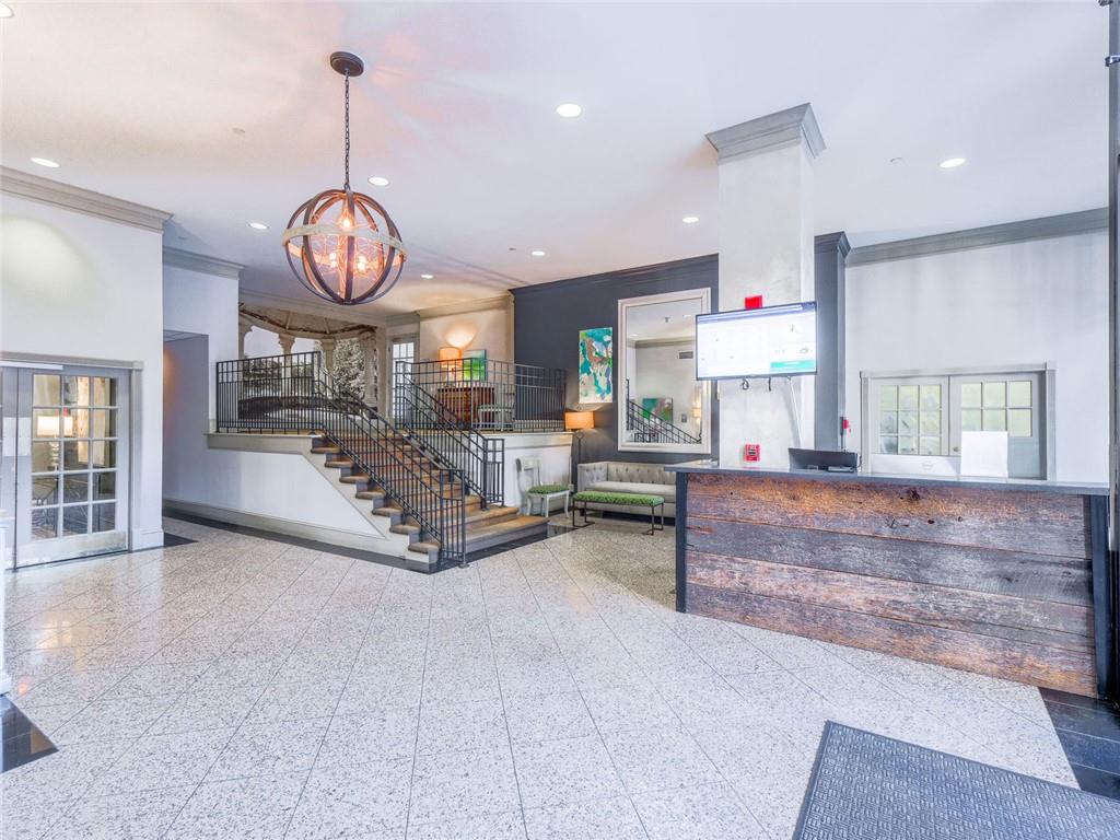 275 13th Street Northeast, Unit 1106 Atlanta, GA 30309 - Photo 19 of 22 a living room with furniture and wooden floor