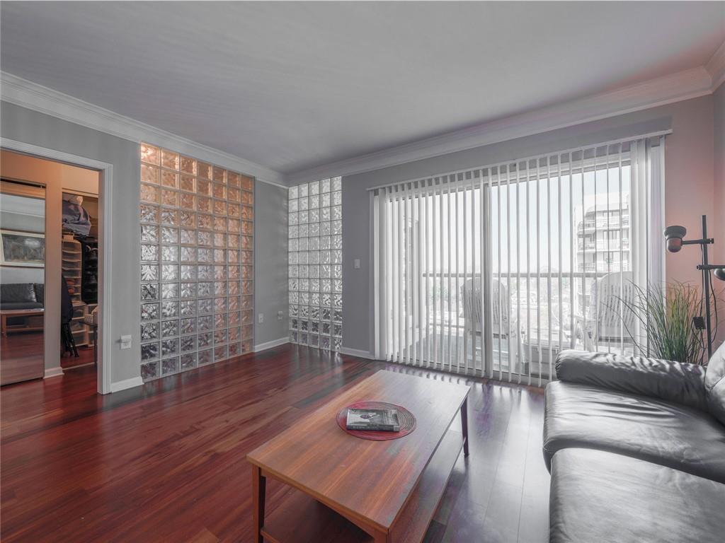 275 13th Street Northeast, Unit 1106 Atlanta, GA 30309 - Photo 7 of 22 a living room with furniture and wooden floor