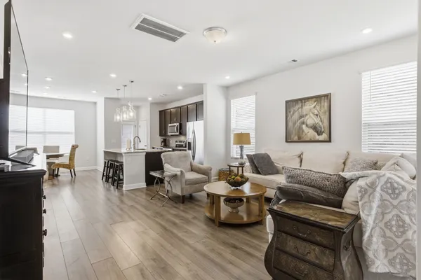 a living room with furniture and a large window