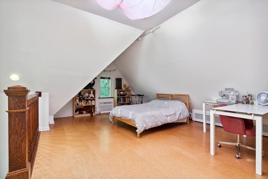 1116 East 48th Street Chicago, IL 60615 - Photo 17 of 25 a bedroom with furniture and a book shelf