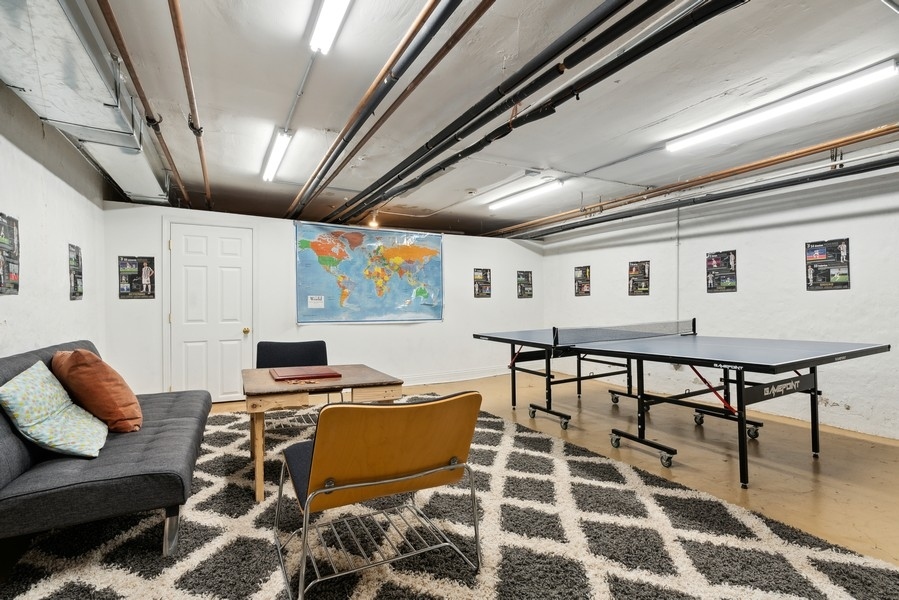 1116 East 48th Street Chicago, IL 60615 - Photo 21 of 25 a workspace with furniture and a rug