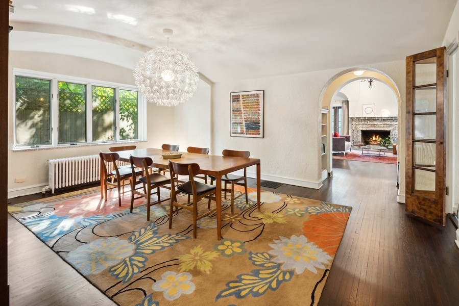 1116 East 48th Street Chicago, IL 60615 - Photo 7 of 25 a view of a dining room with furniture window and wooden floor
