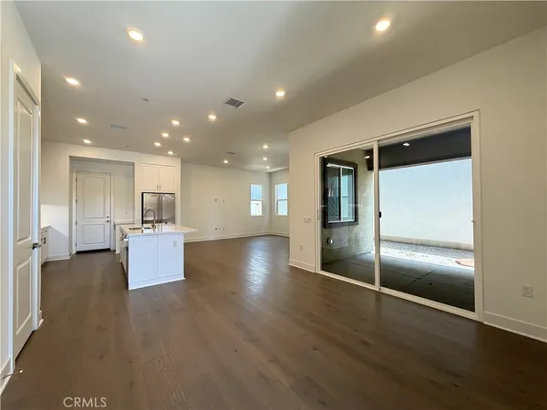 a view of kitchen view wooden floor and window