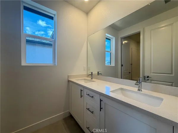 a white bath tub sitting next to a toilet