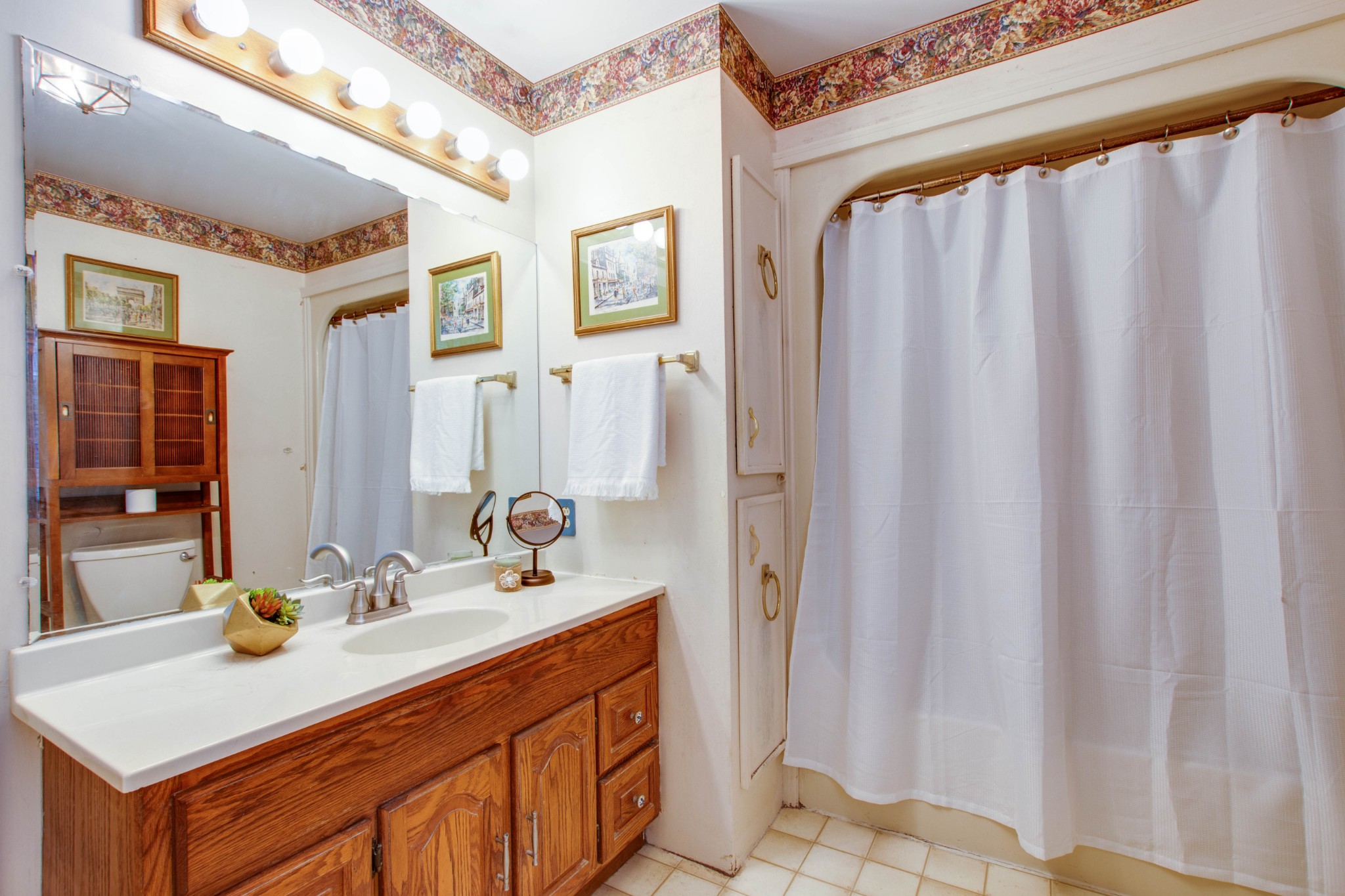 5002 Yorktown Road Nashville, TN 37211 - Photo 17 of 24 a bathroom with a sink and a mirror