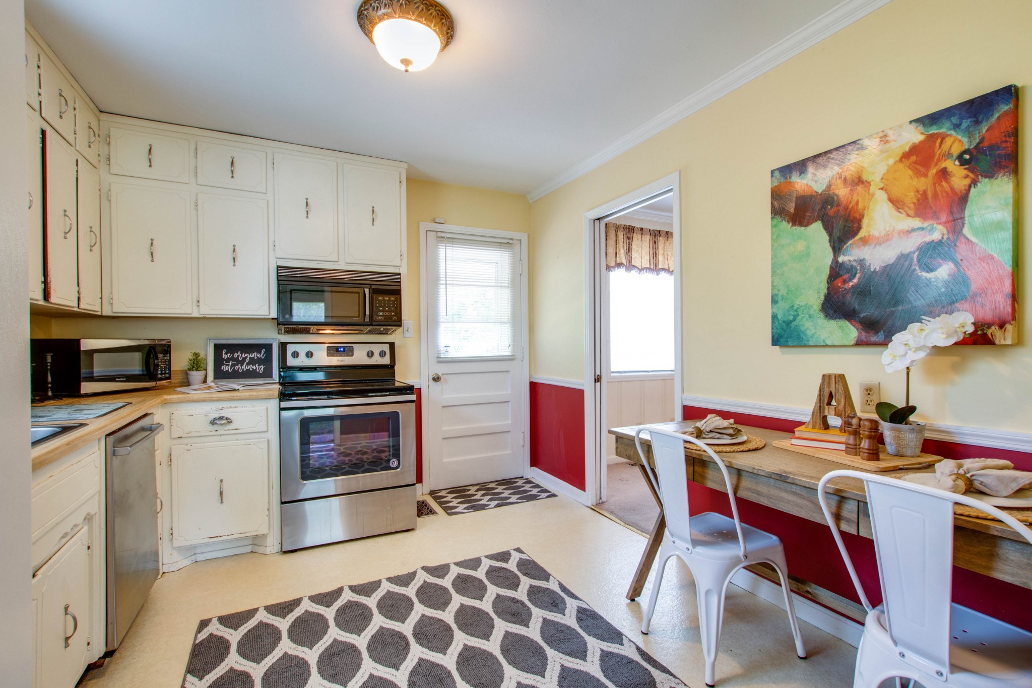 5002 Yorktown Road Nashville, TN 37211 - Photo 7 of 24 a kitchen with a stove a sink and a microwave