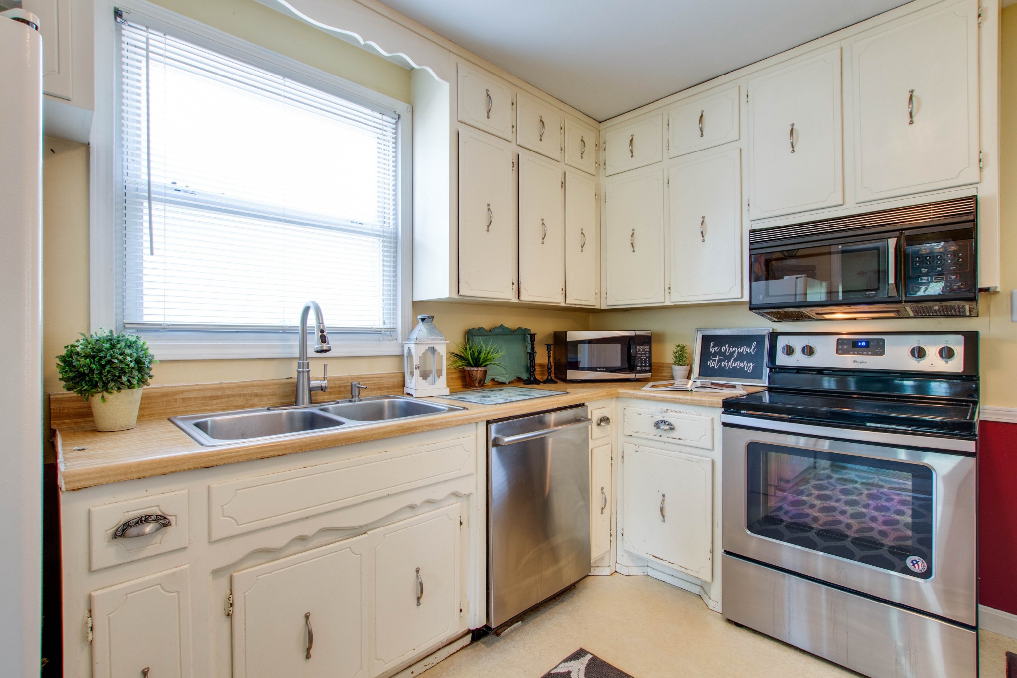 5002 Yorktown Road Nashville, TN 37211 - Photo 8 of 24 a kitchen with cabinets appliances a sink and a window