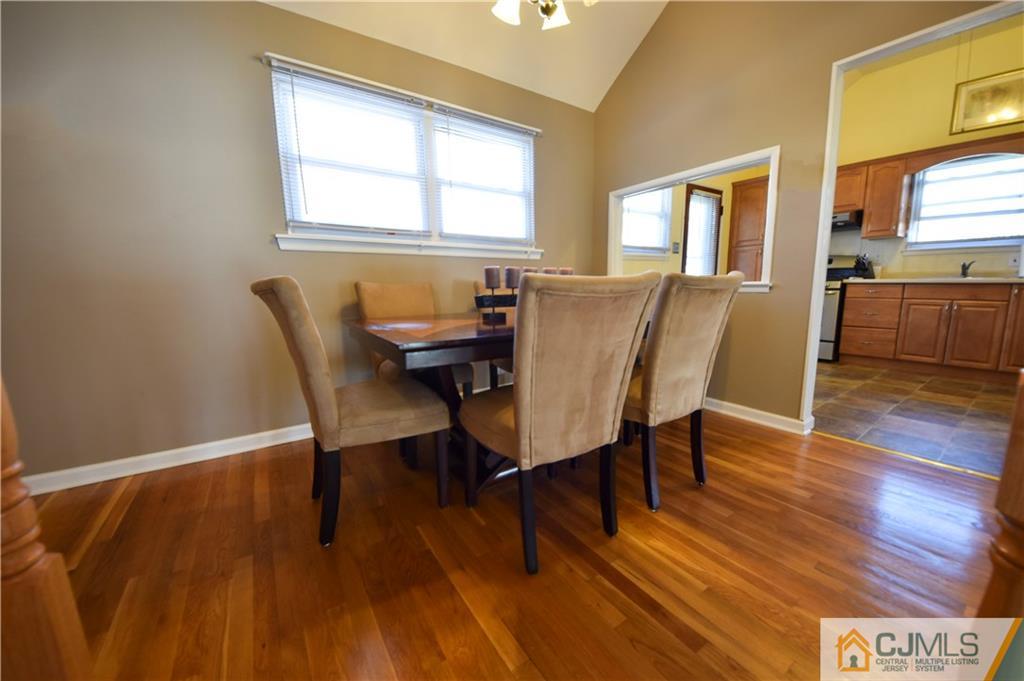 15 Thomas Road East Brunswick, NJ 08816 - Photo 5 of 20 a view of a dining room with furniture and wooden floor