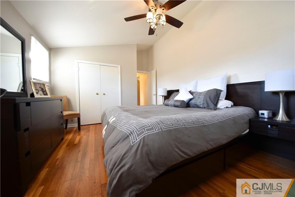15 Thomas Road East Brunswick, NJ 08816 - Photo 10 of 20 a bedroom with a bed and wooden floor