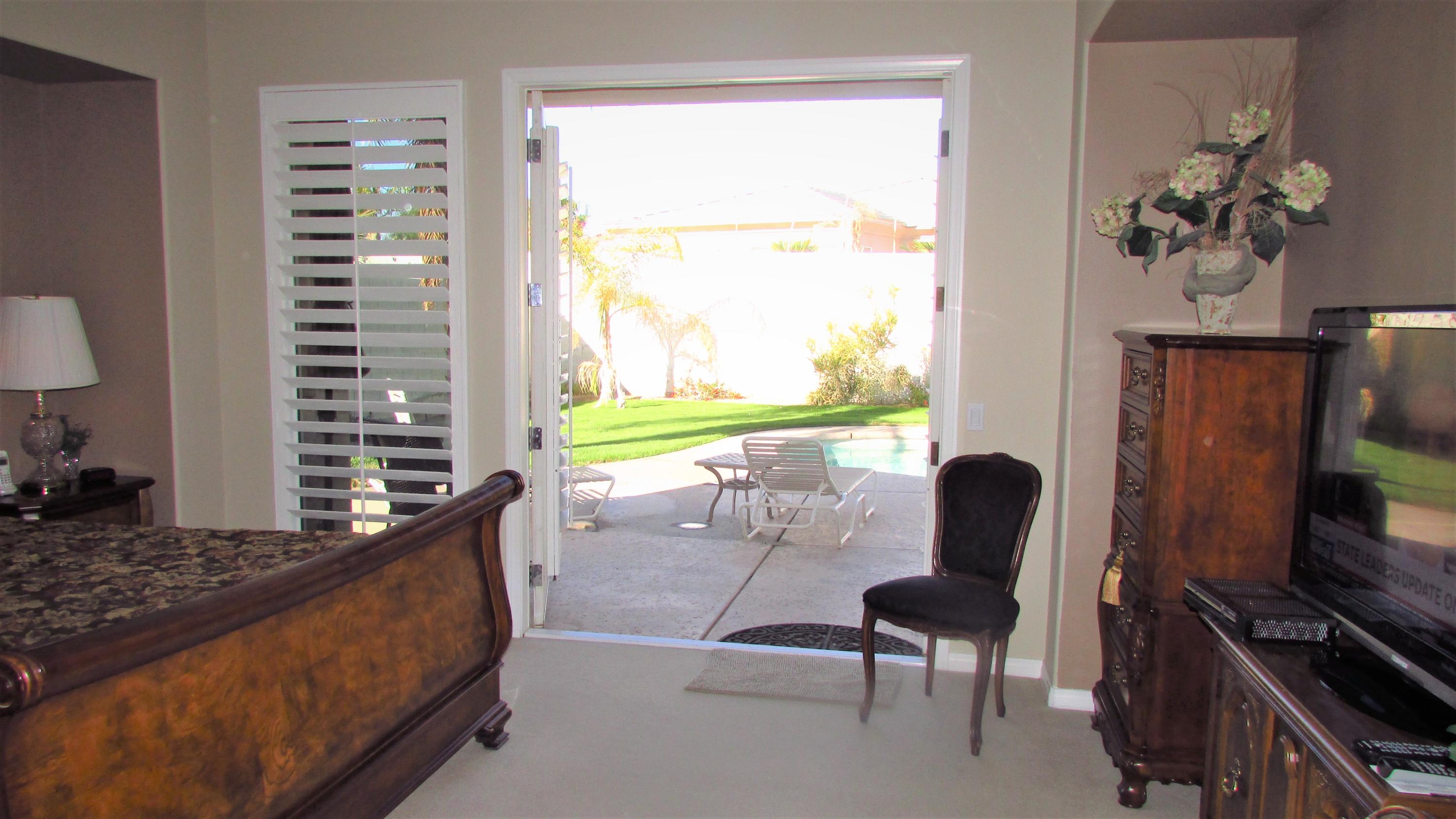 34 Paris Way Rancho Mirage, CA 92270 - Photo 14 of 35 a living room with furniture and a window
