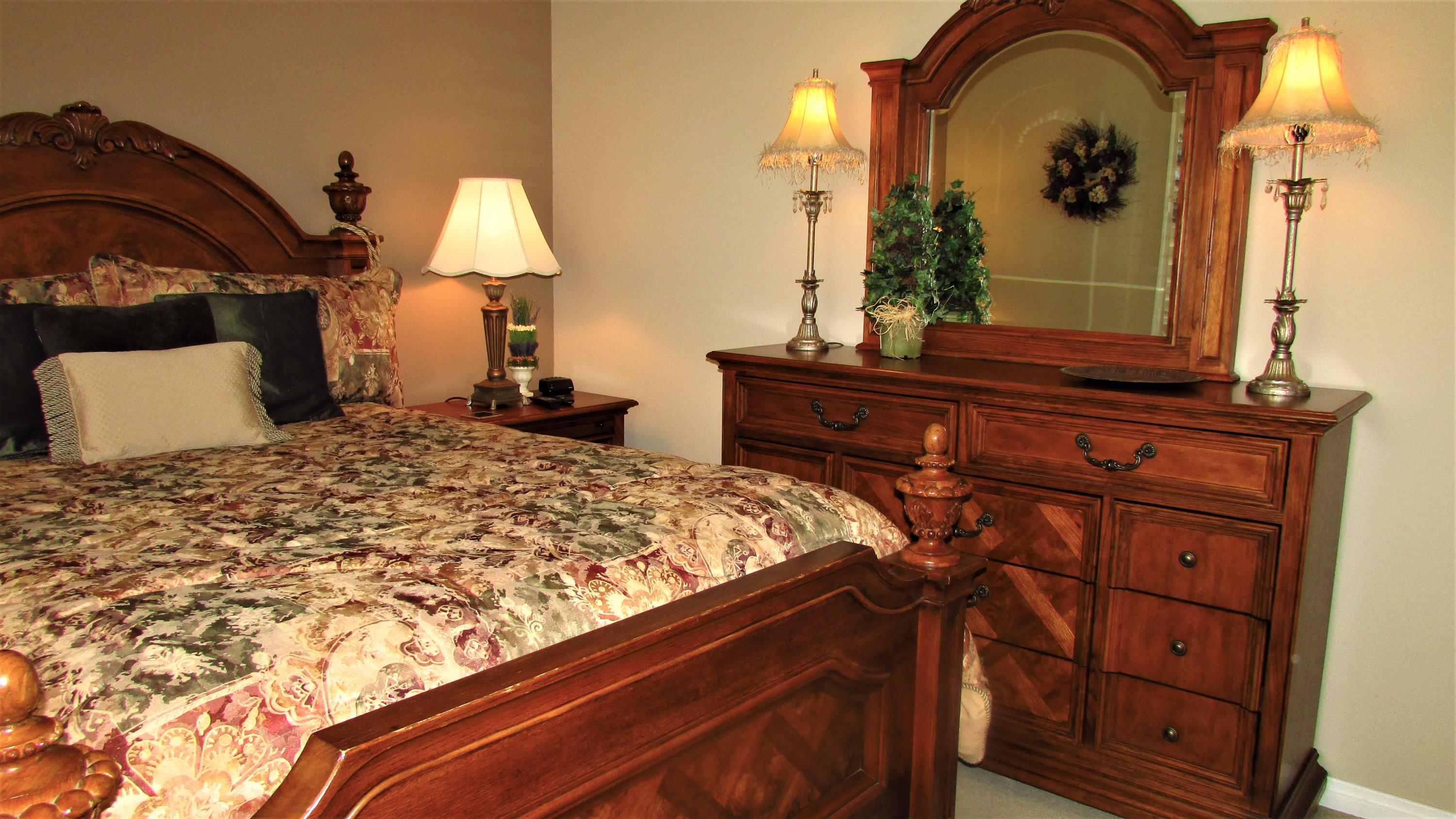 34 Paris Way Rancho Mirage, CA 92270 - Photo 20 of 35 a bedroom with a bed and a dresser