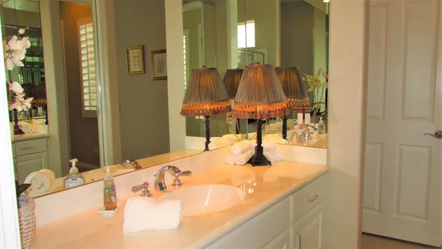 a bathroom with a glass shower door