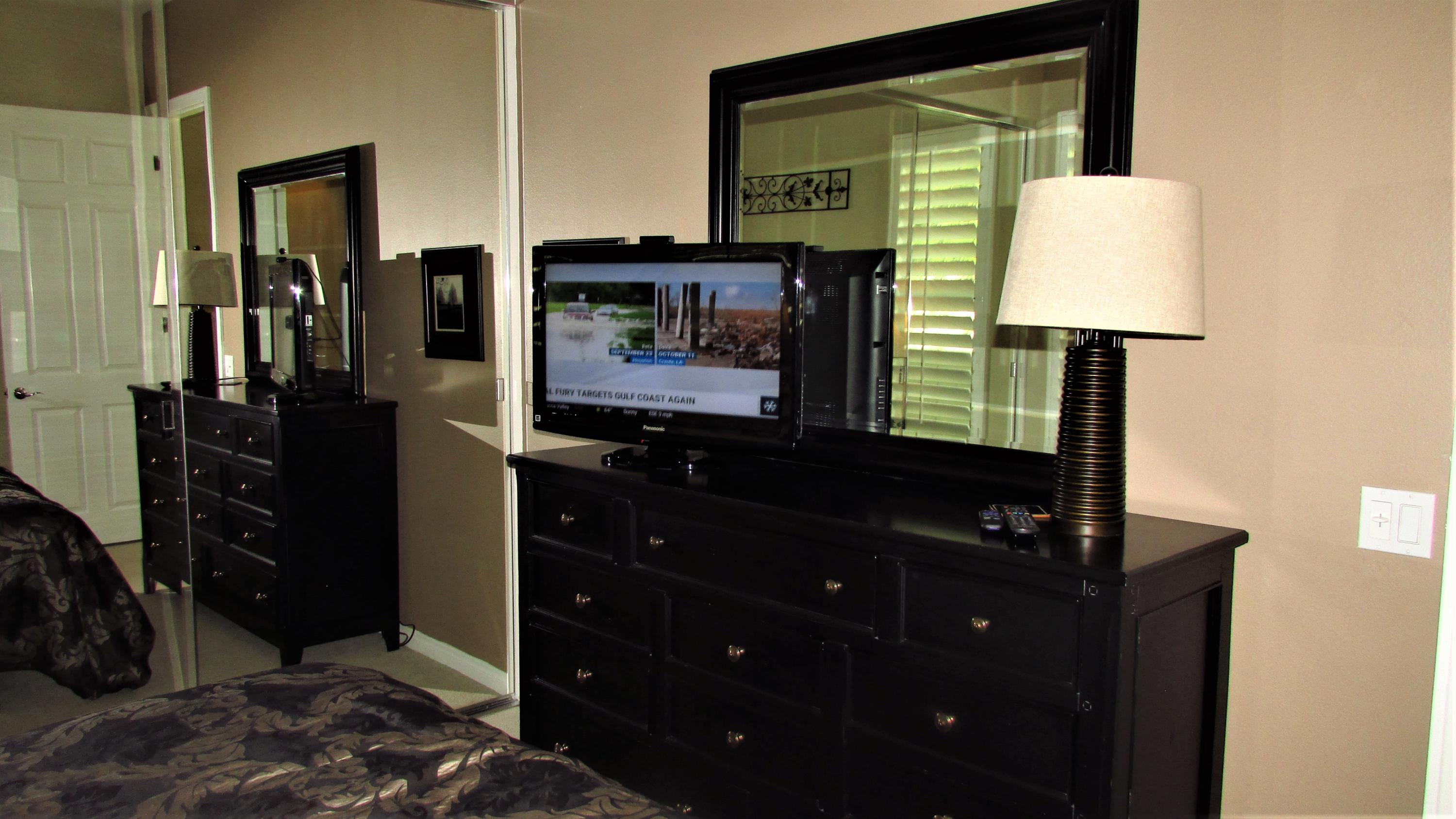 34 Paris Way Rancho Mirage, CA 92270 - Photo 25 of 35 a bathroom with a sink vanity and a mirror