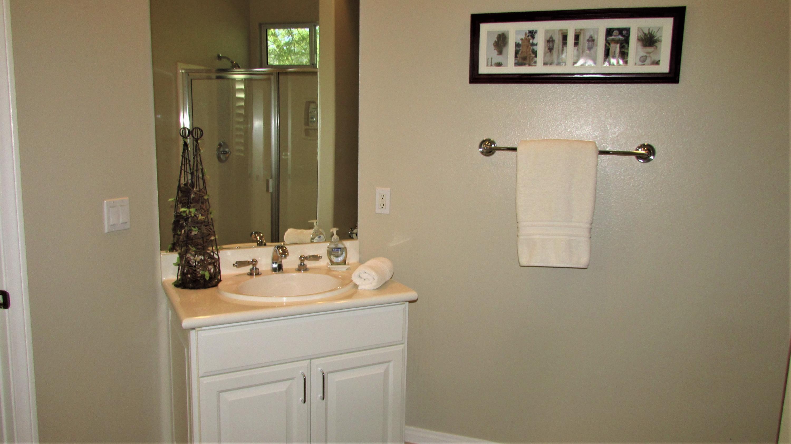 34 Paris Way Rancho Mirage, CA 92270 - Photo 27 of 35 a bathroom with a sink and a mirror