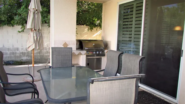 a view of a swimming pool with chairs