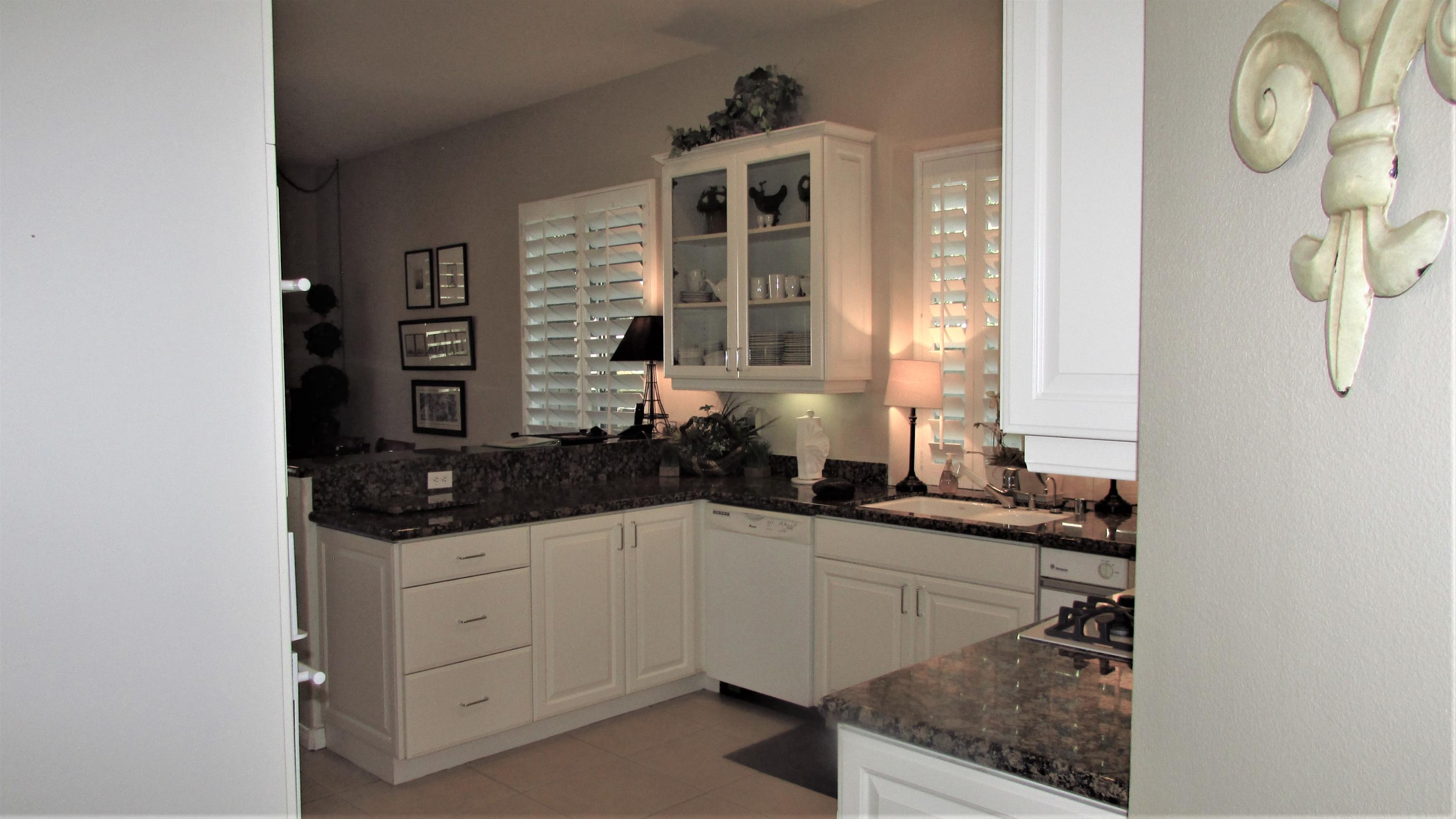 34 Paris Way Rancho Mirage, CA 92270 - Photo 8 of 35 a bathroom with a sink and a mirror