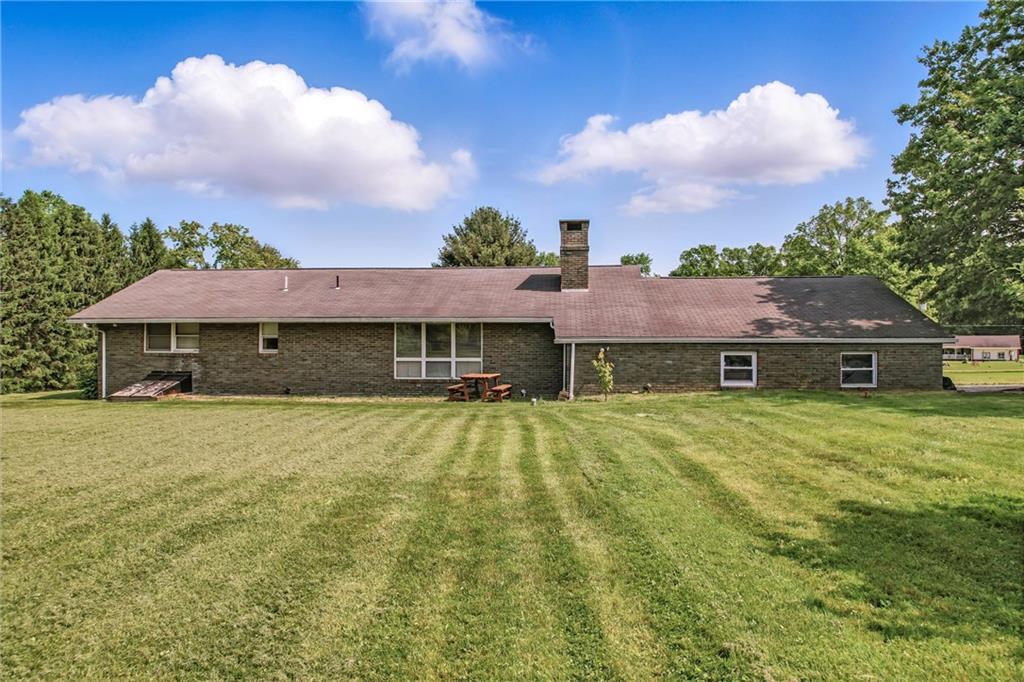 1011 South Lake Road Mercer, PA 16137 - Photo 3 of 22 a front view of a house with garden