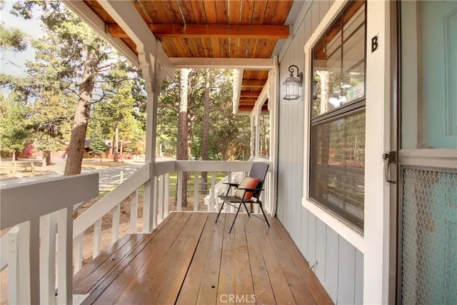 a view of balcony with wooden floor and outdoor space