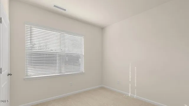 a kitchen with stainless steel appliances granite countertop a sink a refrigerator and a granite counter tops