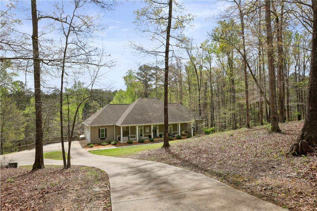 603 Welcome Sargent Road Newnan, GA 30263 - Photo 1 of 1 a front view of a house with garden
