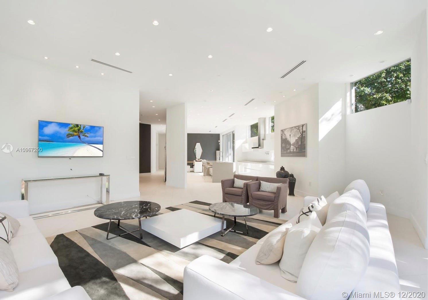 4080 Ensenada Avenue Miami, FL 33133 - Photo 2 of 16 a living room with furniture rug and a table