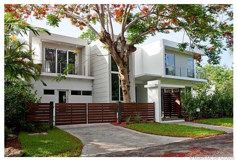 4080 Ensenada Avenue Miami, FL 33133 - Photo 13 of 16 a view of a house with a yard and tree s