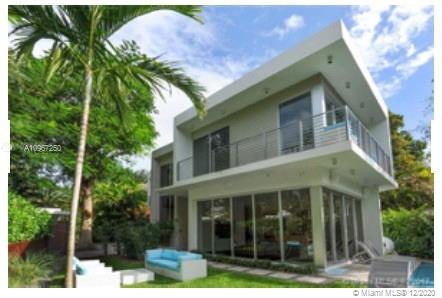 4080 Ensenada Avenue Miami, FL 33133 - Photo 15 of 16 a front view of a house with a garden