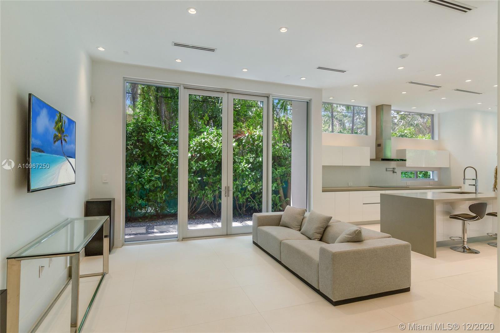 4080 Ensenada Avenue Miami, FL 33133 - Photo 4 of 16 a living room with furniture and a large window