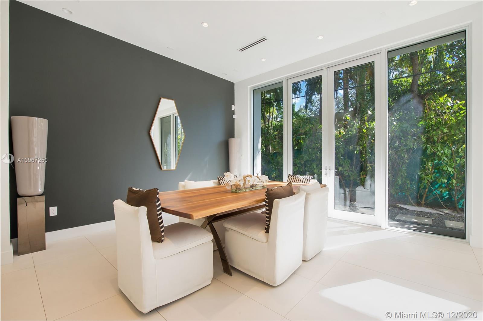 4080 Ensenada Avenue Miami, FL 33133 - Photo 6 of 16 a living room with large windows