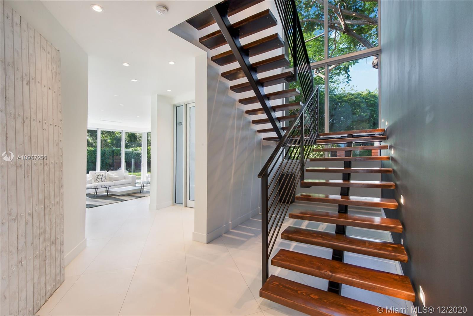 4080 Ensenada Avenue Miami, FL 33133 - Photo 7 of 16 a view of entryway and hall with wooden floor
