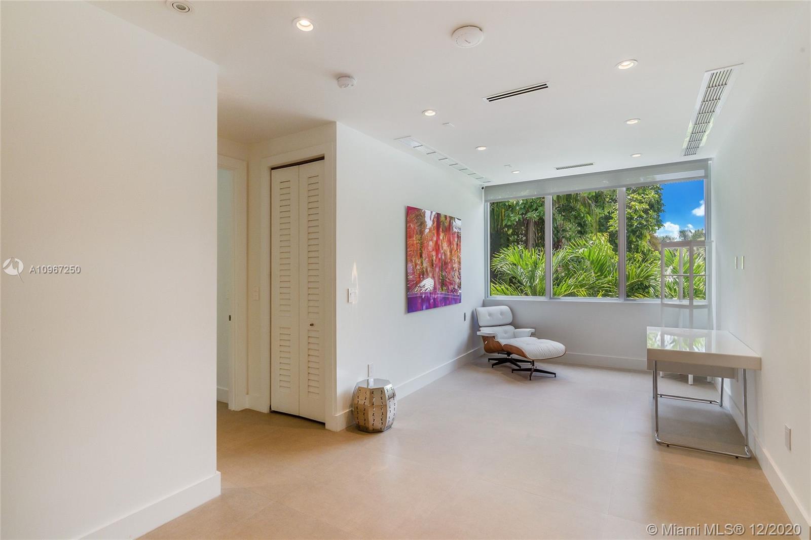 4080 Ensenada Avenue Miami, FL 33133 - Photo 8 of 16 a room with gym equipment and a large window