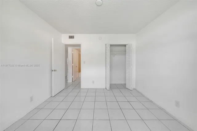 a view of a bathroom with a tub and shower